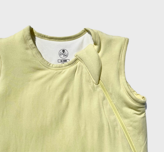 Light yellow sleepsack baby outfit with a two way zipper on a white background